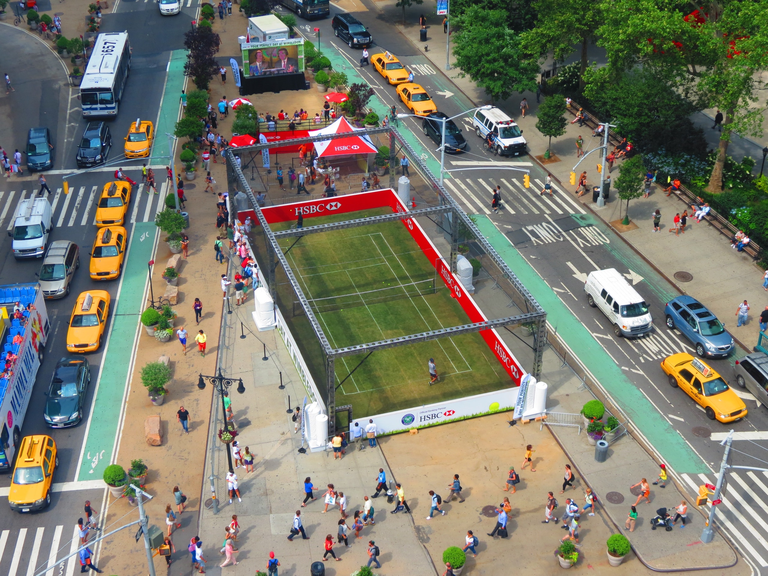 A Wimbledon tennis court is positioned in the middle of the North Flatiron Plaza