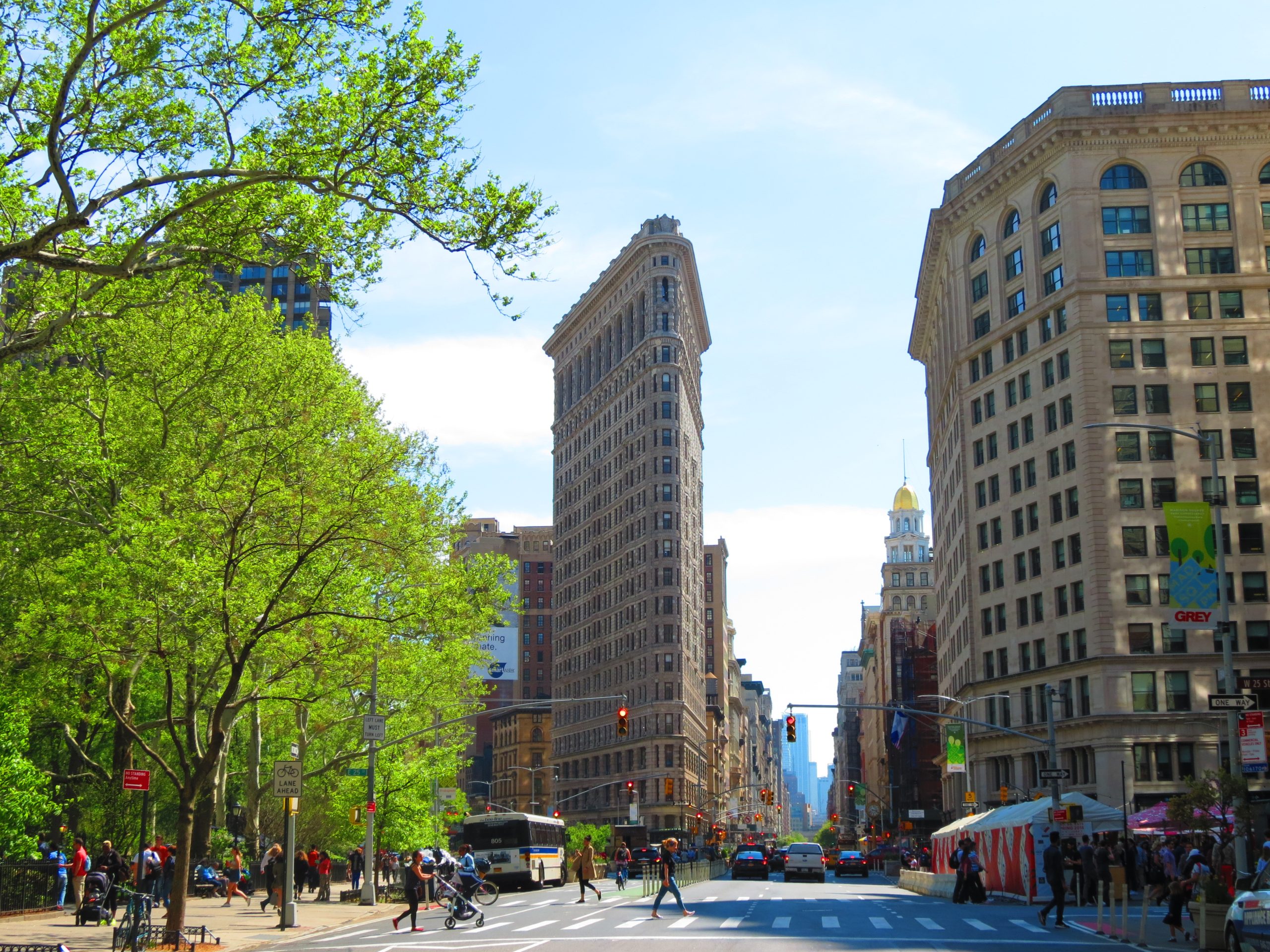 View of the Flatiron Building and Madison Square Park on a summer day